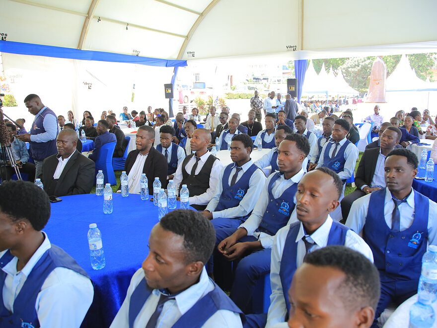 A full marquee of students at a University occasion