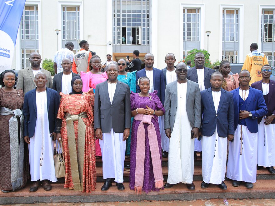 Officers and guests of the University assembled on the steps of a University building
